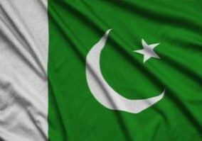 Pakistan flag  is depicted on a sports cloth fabric with many folds. Sport team waving banner